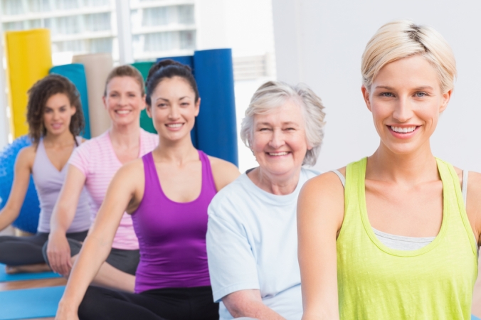 group of women of varying ages in a yoga class