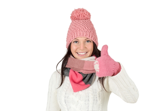 shutterstock_236940868-woman-winter-hat-gloves-thumbs-up-oct16